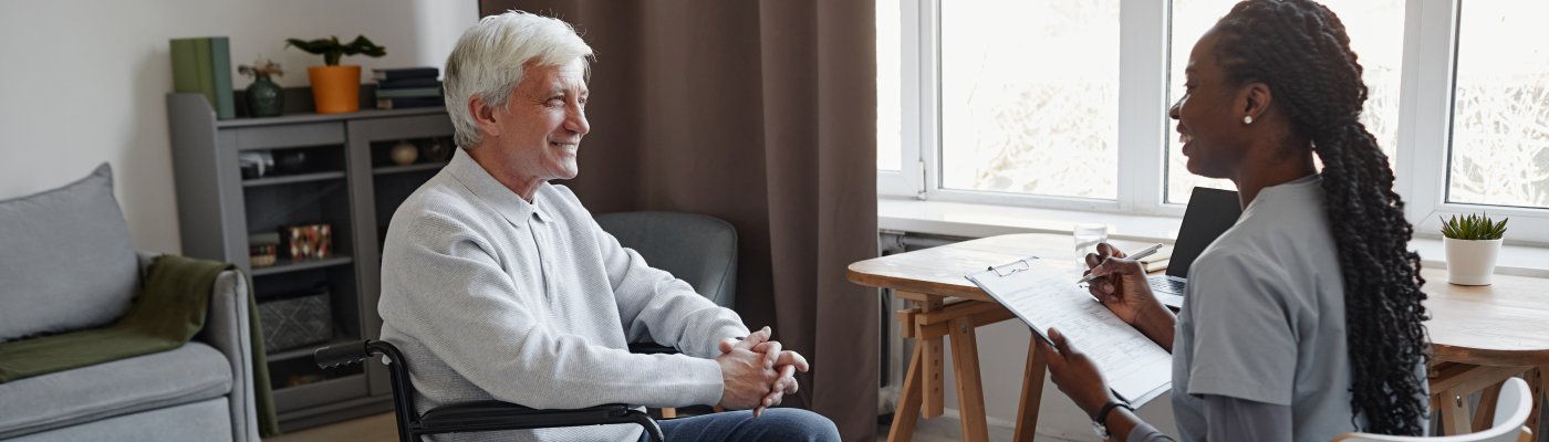 disabled man in wheelchair in front of stairs